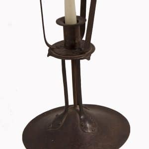 A pair of iron & copper candlesticks-63