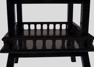 An ebonised table-692