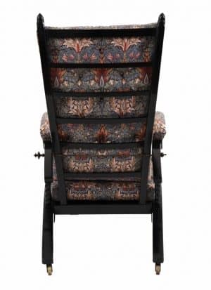 A Morris & Co. ebonised reclining chair -1408