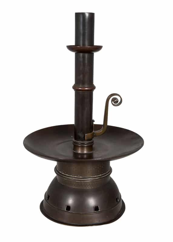 A rare patinated brass candlestick -0 
