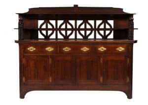 A carved oak side board -0