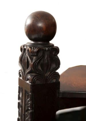 A carved oak side board -1718