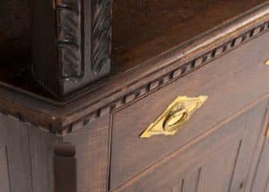 A carved oak side board -1726