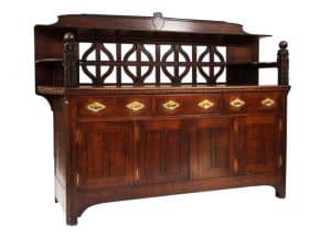 A carved oak side board -1720