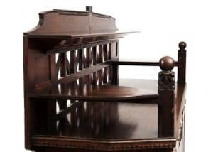 A carved oak side board -1725