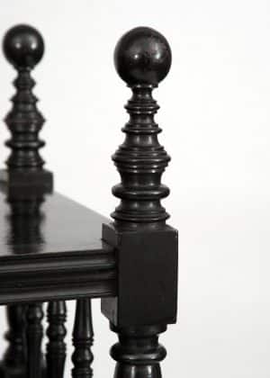 An ebonised whatnot