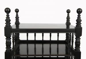 An ebonised whatnot