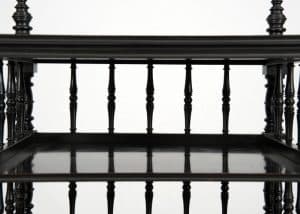 An ebonised whatnot