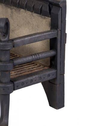 A Gothic Revival fire basket and fire dogs