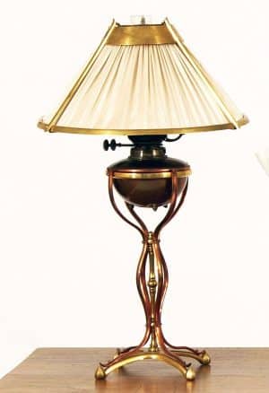 An Arts & Crafts brass and copper table lamp