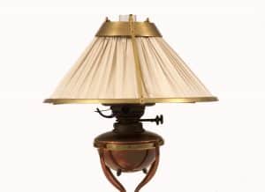 An Arts & Crafts brass and copper table lamp