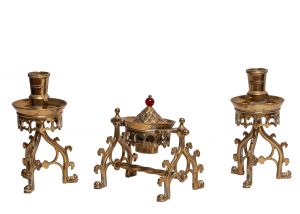 A Gothic Revival brass desk set